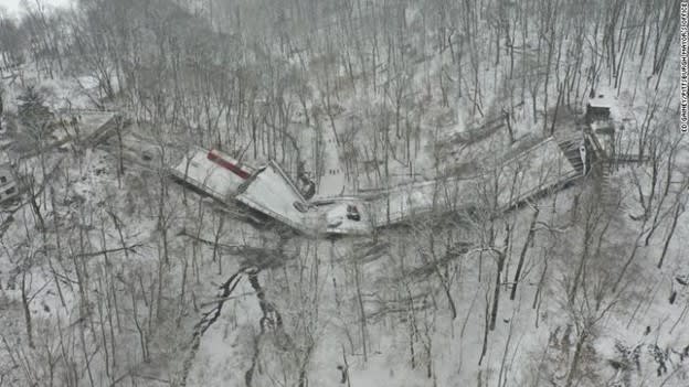 Caption: A Pittsburgh Port Authority bus and several vehicles lie in the collapsed structure. (Credit: Gene J. Puskar / AP Photo)
