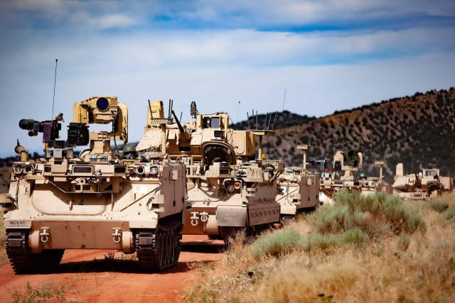 Modified Bradley fighting vehicles and modified M113 tracked armored personnel carriers, or robotic combat vehicles (RCVs), on a training exercise at Fort Carson, Colo. on December 15, 2020. Image: U.S. Department of Defense.