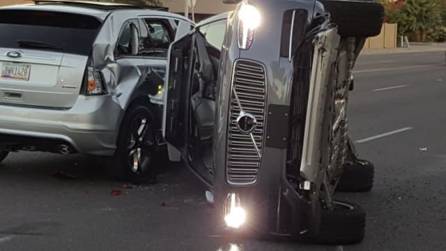 Uber’s Volvo goes through an orange light at 38 mph, hitting a Honda CD-V and two other cars, before turning on its side. No one was killed. The driver in the Honda was issued a ticket for failure to yield. (Image courtesy of Fresco News.)