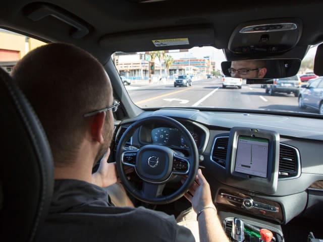 Uber mounts its operator’s console in the center of the vehicle, with the top of the console slightly above the dash of the Volvo XC-90, as shown in this picture from Wired. Below the console is what appears to be the driver’s smartphone with the screen on. Note that the driver is covering the steering wheel with both hands. (Image courtesy of Natalie Behring, Reuters.)